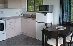 well-equipped kitchen and dining table